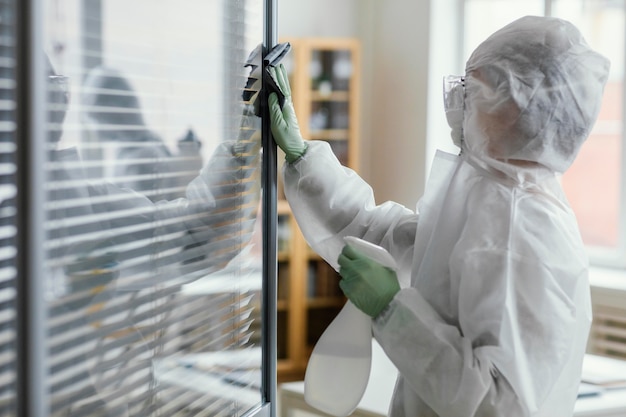 people disinfecting biohazard area